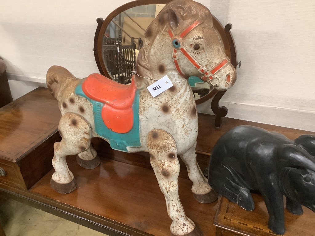 A painted carved wood pig, length 42cm, together with tin plate horse